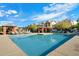 Inviting community pool with plenty of lounge chairs at 2251 S Annie Ln, Gilbert, AZ 85295