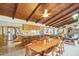 Open kitchen with island seating and wood beam ceiling at 2546 E Hale St, Mesa, AZ 85213