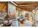 Open living room with wood beams, stone fireplace, and built-in shelving at 2546 E Hale St, Mesa, AZ 85213