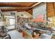 Spacious living room with wood-beamed ceiling and stone fireplace at 2546 E Hale St, Mesa, AZ 85213