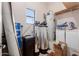 Functional laundry room with water softener and storage at 2632 E Camina Plata --, Gilbert, AZ 85298