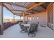 Covered patio with pergola, seating, and tranquil views at 2632 E Camina Plata --, Gilbert, AZ 85298