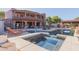 Luxury pool and spa with expansive patio and home view at 2632 E Camina Plata --, Gilbert, AZ 85298