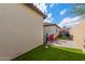 Landscaped backyard with artificial turf and patio at 2955 N Augustine --, Mesa, AZ 85207