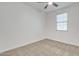 Bright bedroom with ceiling fan and window at 2955 N Augustine --, Mesa, AZ 85207