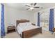 Bright bedroom with wood bed frame and ensuite bathroom at 2955 N Augustine --, Mesa, AZ 85207