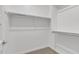 Well-lit closet with shelves and hanging rods at 2955 N Augustine --, Mesa, AZ 85207