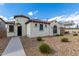 Single-story home with Spanish-style architecture, walkway, and landscaped yard at 2955 N Augustine --, Mesa, AZ 85207