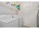 Bright laundry room with washer, dryer, and shelving at 2955 N Augustine --, Mesa, AZ 85207