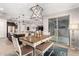 Bright dining area with table, bench seating, and access to backyard patio at 4969 W Beckham Way, San Tan Valley, AZ 85144