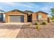 Single-story home with gray garage door and landscaped yard at 4969 W Beckham Way, San Tan Valley, AZ 85144