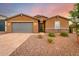 Single-story home with gray door and brick accents at 4969 W Beckham Way, San Tan Valley, AZ 85144