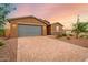 Single-story home with gray garage door and landscaped yard at 4969 W Beckham Way, San Tan Valley, AZ 85144