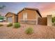 Side view of a single-story home with gray garage door at 4969 W Beckham Way, San Tan Valley, AZ 85144