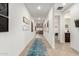 Bright hallway with light walls and a view to living room at 4969 W Beckham Way, San Tan Valley, AZ 85144