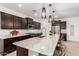 Modern kitchen with granite countertops, stainless steel appliances, and an island at 4969 W Beckham Way, San Tan Valley, AZ 85144