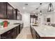 Modern kitchen with granite countertops and stainless steel appliances at 4969 W Beckham Way, San Tan Valley, AZ 85144