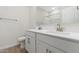 Bathroom featuring dual sinks, white cabinets, and modern fixtures with a walk in shower at 7450 S 75Th Dr, Laveen, AZ 85339