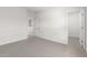Neutral-toned bedroom with plush carpeting, complemented by white walls and natural light at 7450 S 75Th Dr, Laveen, AZ 85339
