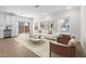 Bright living room showcasing hardwood floors, white walls, and modern furnishings at 7450 S 75Th Dr, Laveen, AZ 85339