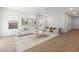 Living room featuring hardwood floors, white walls, modern seating, and natural light at 7450 S 75Th Dr, Laveen, AZ 85339