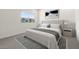 Well-lit main bedroom featuring soft lighting, neutral decor, and comfortable furnishings, offers a serene retreat at 7450 S 75Th Dr, Laveen, AZ 85339