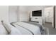 Luxurious main bedroom with plush bedding, a modern console, and an attached bath offering comfort and style at 7450 S 75Th Dr, Laveen, AZ 85339