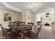 Charming dining room showcases a stylish table setting and wood flooring at 8653 E Royal Palm Rd # 2005, Scottsdale, AZ 85258
