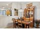 Charming dining area with rustic wood table and hutch at 10873 E Salt Bush Dr, Scottsdale, AZ 85255