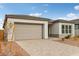 Modern home with neutral siding, attached garage, and desert landscaping at 11512 E Utah Ave, Mesa, AZ 85212