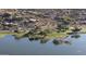 This aerial view shows the park by the water and the beautiful surrounding community at 14211 N Fountain Hills Blvd # B, Fountain Hills, AZ 85268