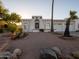 Stylish southwestern home featuring a unique arched entryway, white stucco, and desert landscaping at 14211 N Fountain Hills Blvd # B, Fountain Hills, AZ 85268