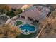 Aerial view showcasing the home's layout, pool, and solar panels at 1840 W Sierra Sunset Trl, Phoenix, AZ 85085