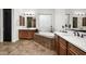 Bathroom featuring double vanity, soaker tub, tile backsplash, and a black door at 1840 W Sierra Sunset Trl, Phoenix, AZ 85085