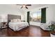 Spacious bedroom with plush bed, hardwood floors, and backyard views at 1840 W Sierra Sunset Trl, Phoenix, AZ 85085