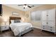 Bedroom with wood-like floors and white dresser at 1840 W Sierra Sunset Trl, Phoenix, AZ 85085
