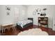 Cozy bedroom with twin bed, bookshelf, and plenty of natural light at 1840 W Sierra Sunset Trl, Phoenix, AZ 85085