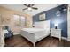 Bedroom with a white bed frame and blue accent wall at 1840 W Sierra Sunset Trl, Phoenix, AZ 85085