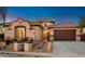 Beautiful Spanish-style home with a two-car garage and mature landscaping at 1840 W Sierra Sunset Trl, Phoenix, AZ 85085