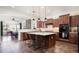 Spacious kitchen featuring stainless appliances, an island with seating, and open floor plan at 1840 W Sierra Sunset Trl, Phoenix, AZ 85085