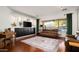 Spacious living room with leather sofas and built-in entertainment center at 1840 W Sierra Sunset Trl, Phoenix, AZ 85085