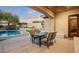 Covered patio overlooking the pool and backyard at 1840 W Sierra Sunset Trl, Phoenix, AZ 85085