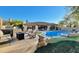 Inviting backyard oasis with a sparkling pool and patio at 1840 W Sierra Sunset Trl, Phoenix, AZ 85085