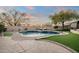 Relaxing backyard with a freeform pool and artificial turf at 1840 W Sierra Sunset Trl, Phoenix, AZ 85085