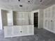 Spacious living room features unfinished walls and ceiling with a door leading to the pantry at 22835 E Lords Way, Queen Creek, AZ 85142