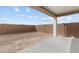 Open backyard area featuring a covered patio, perfect for outdoor entertaining at 23411 W Albeniz Pl, Buckeye, AZ 85326