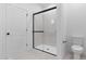 Modern bathroom showcasing glass-enclosed shower and updated fixtures at 23411 W Albeniz Pl, Buckeye, AZ 85326