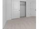 Neutral bedroom featuring a closet and adjacent door showcasing spacious layout at 23411 W Albeniz Pl, Buckeye, AZ 85326