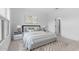 Bright bedroom featuring a stylish accent wall, modern lamps, and contemporary decor at 23411 W Albeniz Pl, Buckeye, AZ 85326
