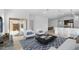 Inviting living room featuring a comfortable seating arrangement, contemporary decor, and ample natural light at 23411 W Albeniz Pl, Buckeye, AZ 85326